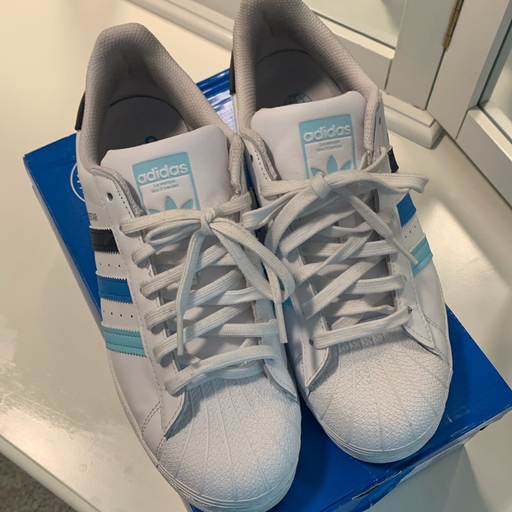 Men’s Adidas Superstar sneakers.